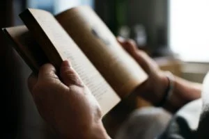 Close up of a man reading a book